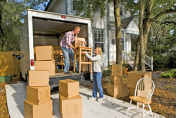 couple unloading moving van
