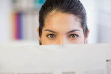 woman reading newsletter