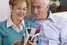 couple looking at self-mailer