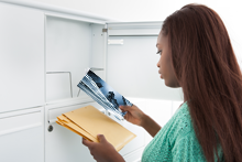 woman looking at mail