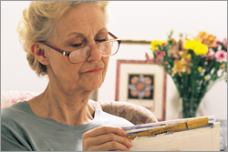 senior woman reading mail