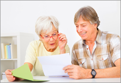 older couple reading letter